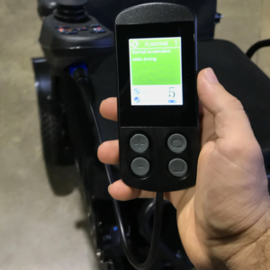 PROGRAMMER FOR FOLDABLE ELECTRIC WHEELCHAIRS